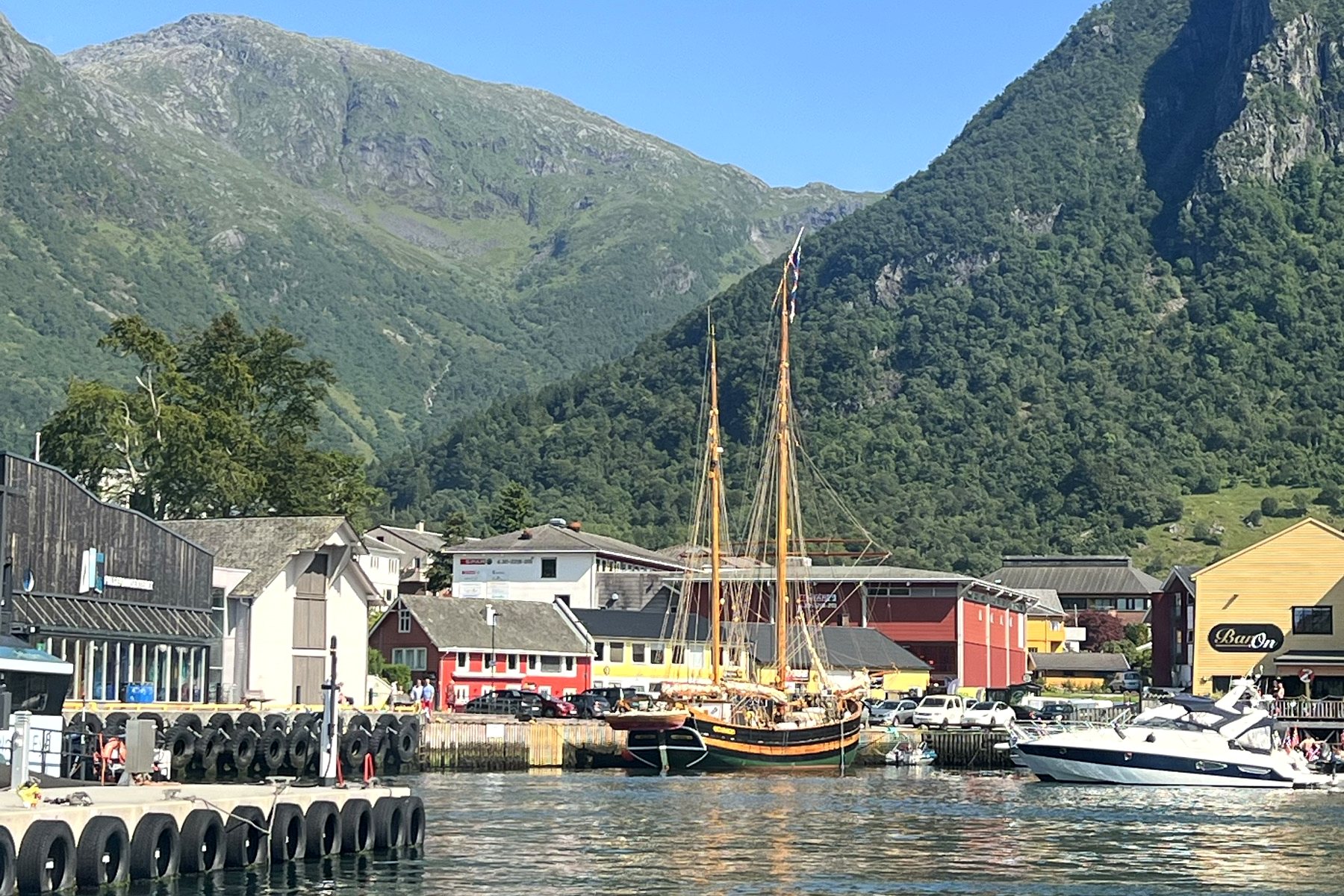 Boats moored below a mountain