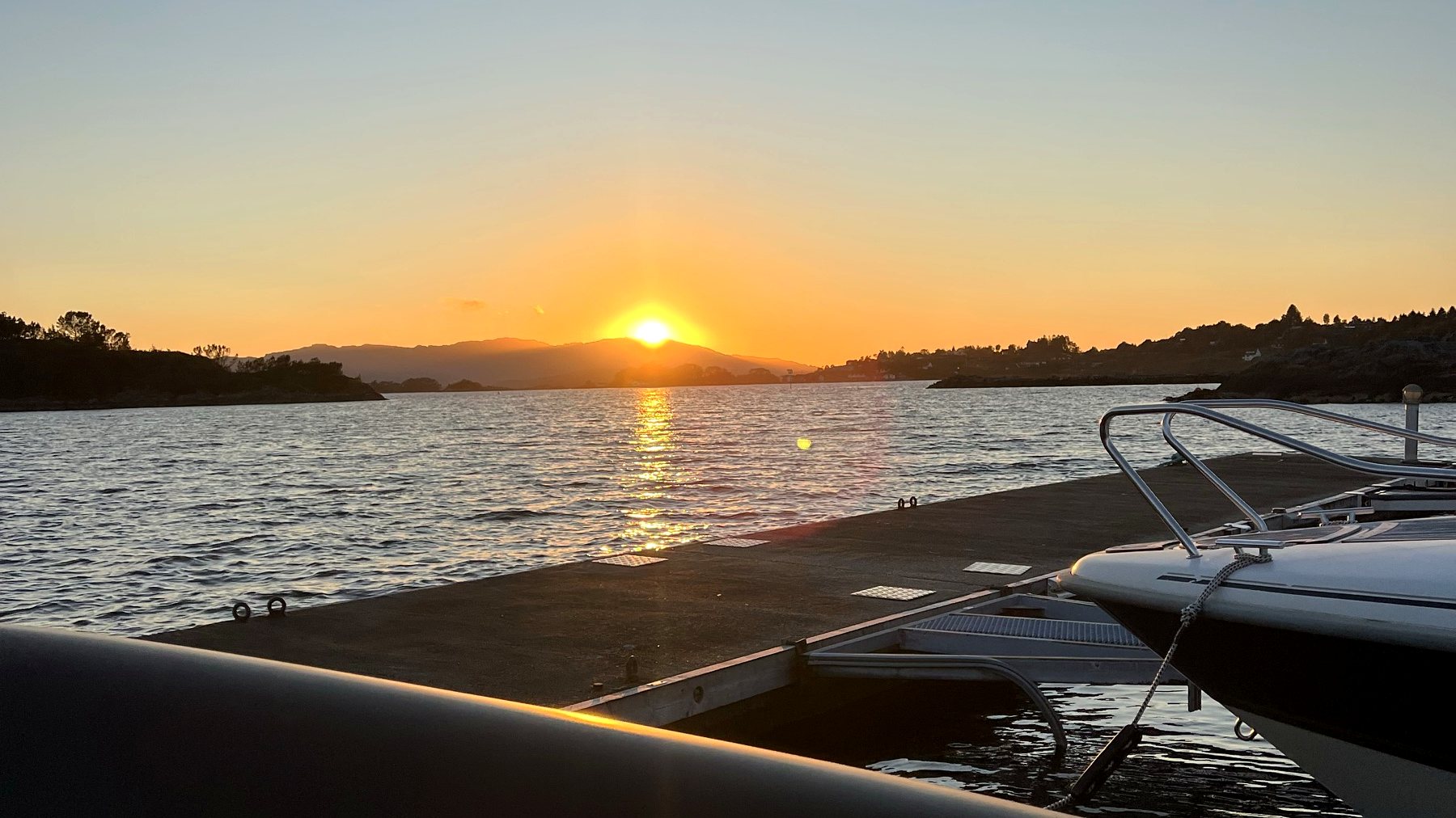 Sunset over the fjord from the boat