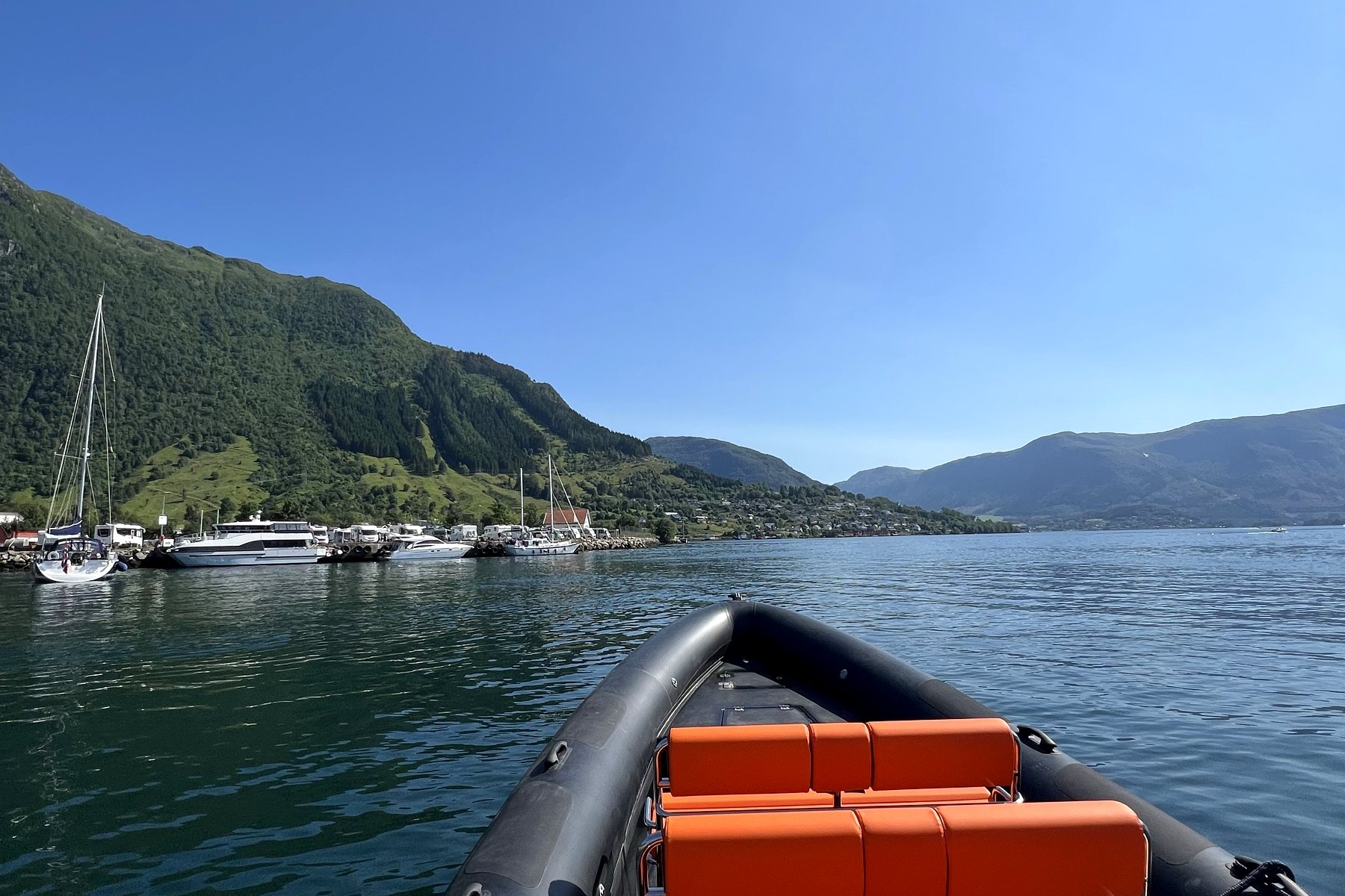 RIB seats and open fjord under a clear Norwegian sky