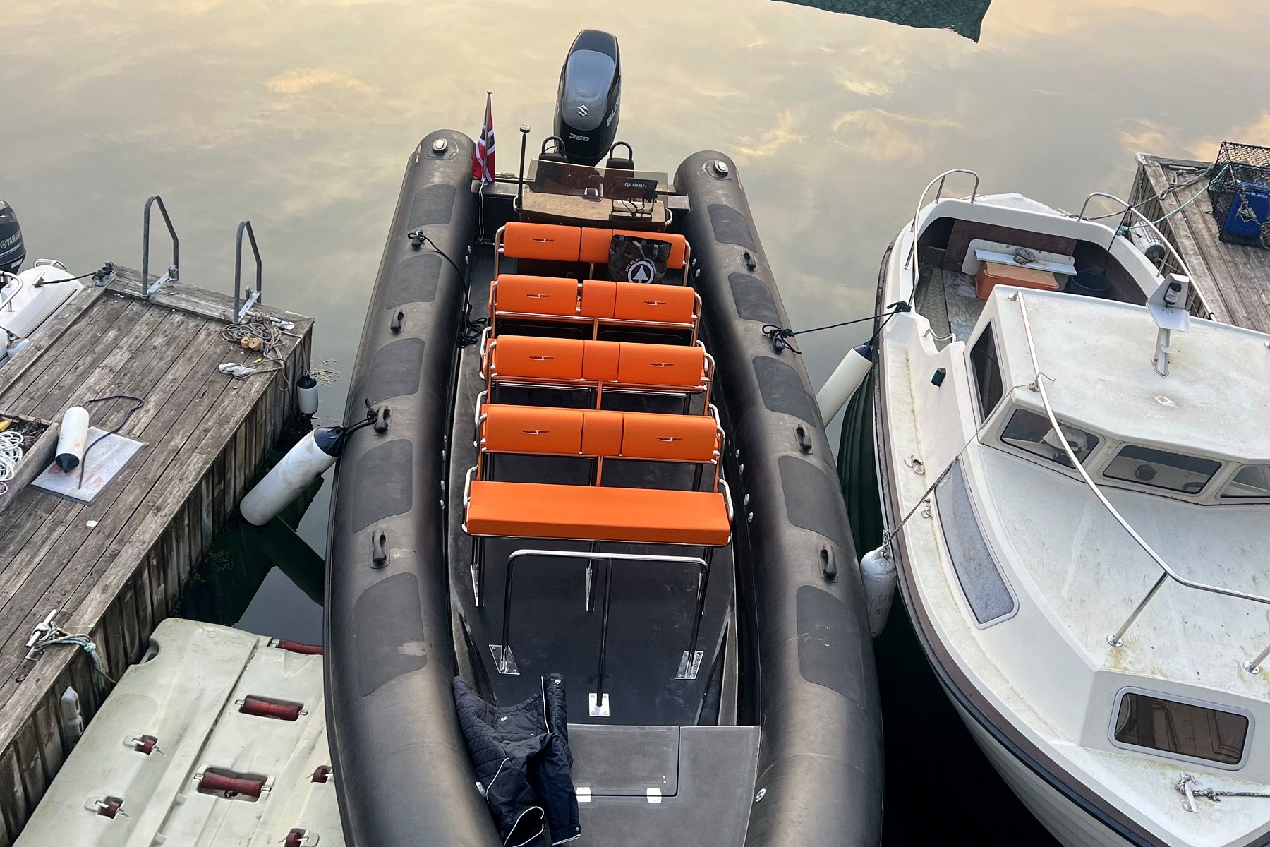 A private RIB charter cruising the fjord for a small group